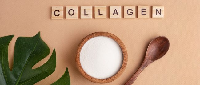 Image shows the word collagen spelt out in tiles, with a leaf and a spoon and a small pot of powdered collagen