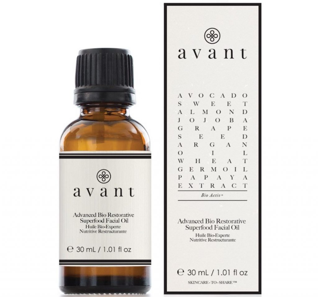 A small brown glass bottle with a beige label, stood next to a box package with avant written across the top. Early summer beauty edit avant superfood facial oil.