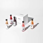 A white box labelled Jukes and five bottles of their non-alcoholic wine from The Tasting Box, set on a white background