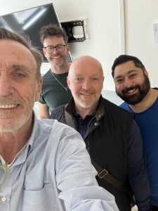 Selfie of four adult men of various ages in a studio - Sober Companion interview on Silver