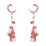 Dangly gold earrings with pink and pearl stones on. 