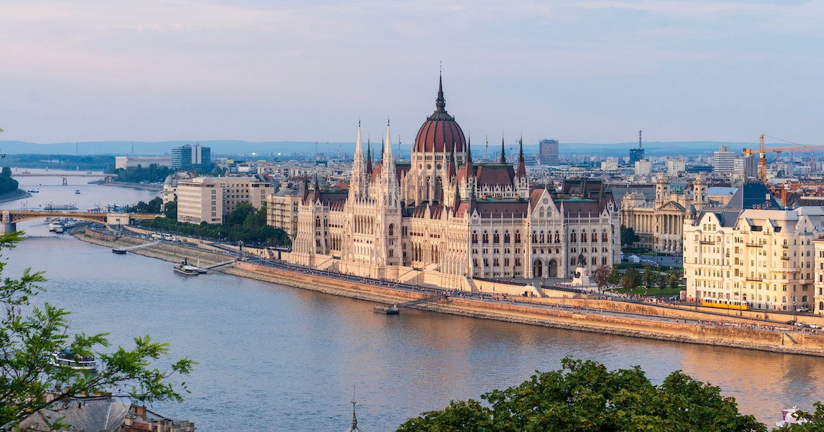 Wide river with beautiful domed building sat on the edge of the river. Budapest for September city break