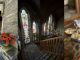 Image composite of three shots - the outside of a hotel with stone walls and nice flowers, middle shot shows a stairwell with stained glass windows, and final image is of a porn star martini