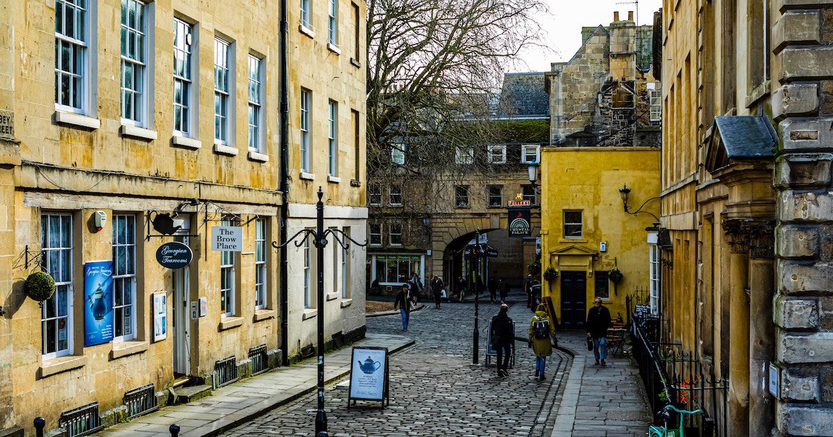 Cobbled street in Bath. Beautiful old English buildings. Best tours England for over 50s