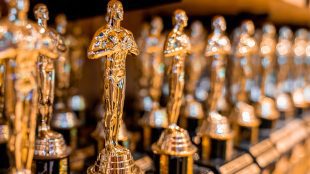 Image shows lineup of Oscars statues