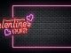 Image shows Valentine's Day neon sign on a black background