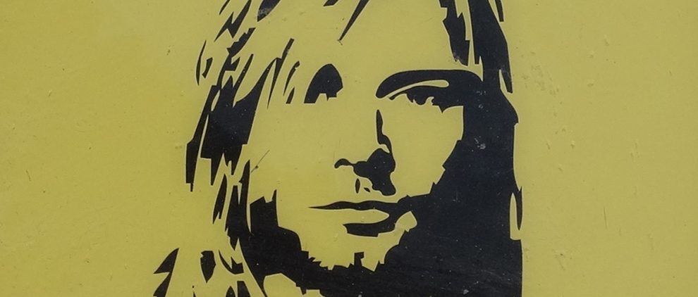 Image shows a portrait of Nirvana singer Kurt Cobain